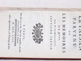 a book that is open on a white surface