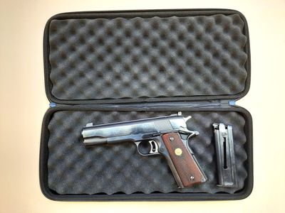 a gun that is in a case on a table