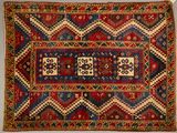 an old rug with a red, blue, and yellow design