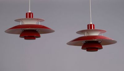 two red and white lamps hanging from the ceiling