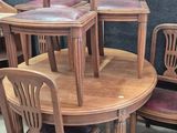 several chairs and a table are stacked on top of each other