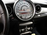 a car dashboard with a speedometer and a steering wheel