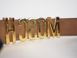 moschi belt with gold metal letters on a brown leather belt