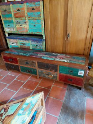 a bench made out of old wooden crates in a living room