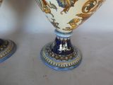 two vases that are sitting on a table