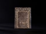 an old photo frame sitting on top of a wooden table