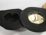 two hats sitting on top of each other on a table