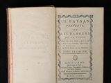 an old book opened on a black surface