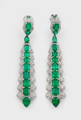 a pair of emerald and diamond earrings
