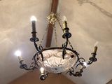 a chandelier hanging from the ceiling in a room