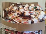 a cardboard box filled with assorted candy and candy bars