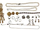 many different types of jewelry on a white background