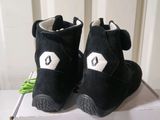 a box with a pair of black shoes on it