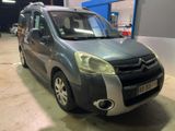 a small grey van parked in a garage