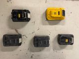 five different batteries on the floor next to each other