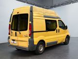 a yellow van that is parked inside of a building