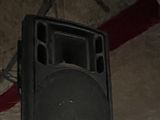 a speaker that is hanging from the ceiling in a room
