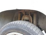 a close up of a tire on a white truck
