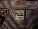 a label on a jacket that says,,,,,,,,,,,,,,,,,,,,,,,