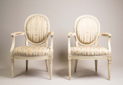 pair of louis xvi style armchairs with striped upholstered seats