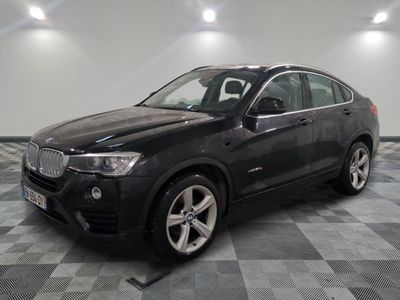 a picture of a black bmw suv parked in a garage