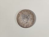 an old silver coin with a coat of arms on it