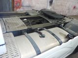 an image of a truck with its hood open and the engine in the back
