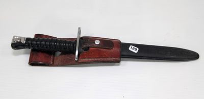 a knife that is laying on top of a piece of leather
