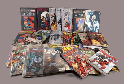 a lot of comic books sitting on a table