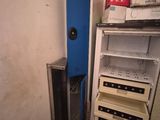 a refrigerator that has a bunch of bottles in it