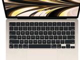 un gros plan d'un ordinateur portable avec son clavier, sur fond blanc