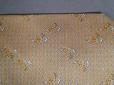 an image of a yellow tie with a pattern on it