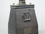 a small machine that is sitting on a white surface