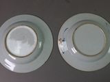 two plates that are sitting on a table