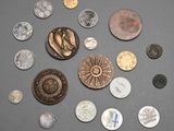 a lot of coins that are sitting on a table