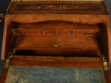 a small wooden box with a drawer on top of it