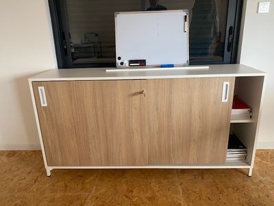 a tv that is sitting on top of a cabinet