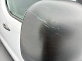 a side view mirror of a car with a reflection on the side of it