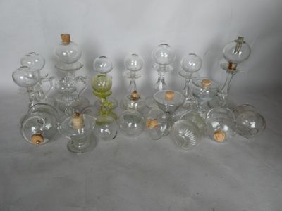 a lot of glass bottles with corks on them