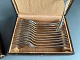 a lot of spoons in a box on the table