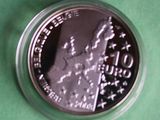 a silver coin with a picture of a woman on it