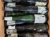 many bottles of wine in a box on the table