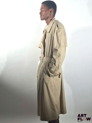an image of a man in a trench coat