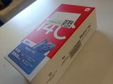 a white table with a box on it that has a red box on top of it