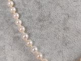 a close up of a necklace on a mannequin mannequin