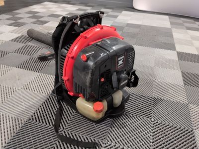 an image of a small blower on a checkered floor