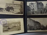 a hand holding a book with pictures of old buildings on it