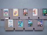 a lot of video game cartridges on the wall