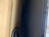 a television that is connected to a wall with a cord