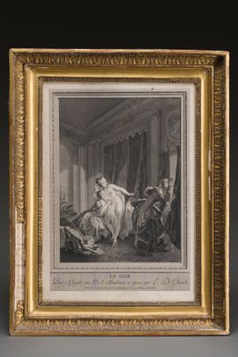 an old picture of a woman sitting on a bed in a room